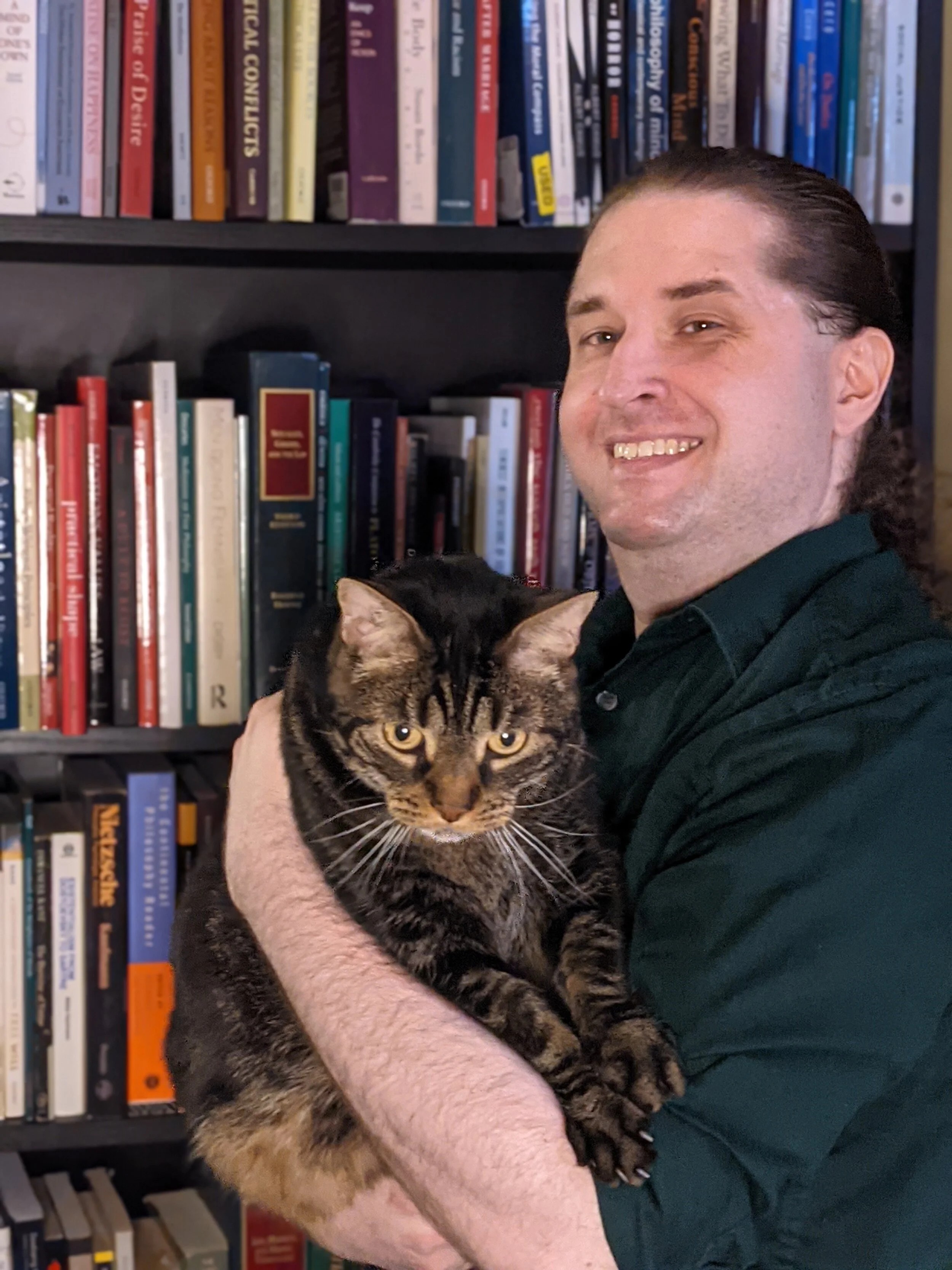Duane holding a gorgeous marbled taby cat